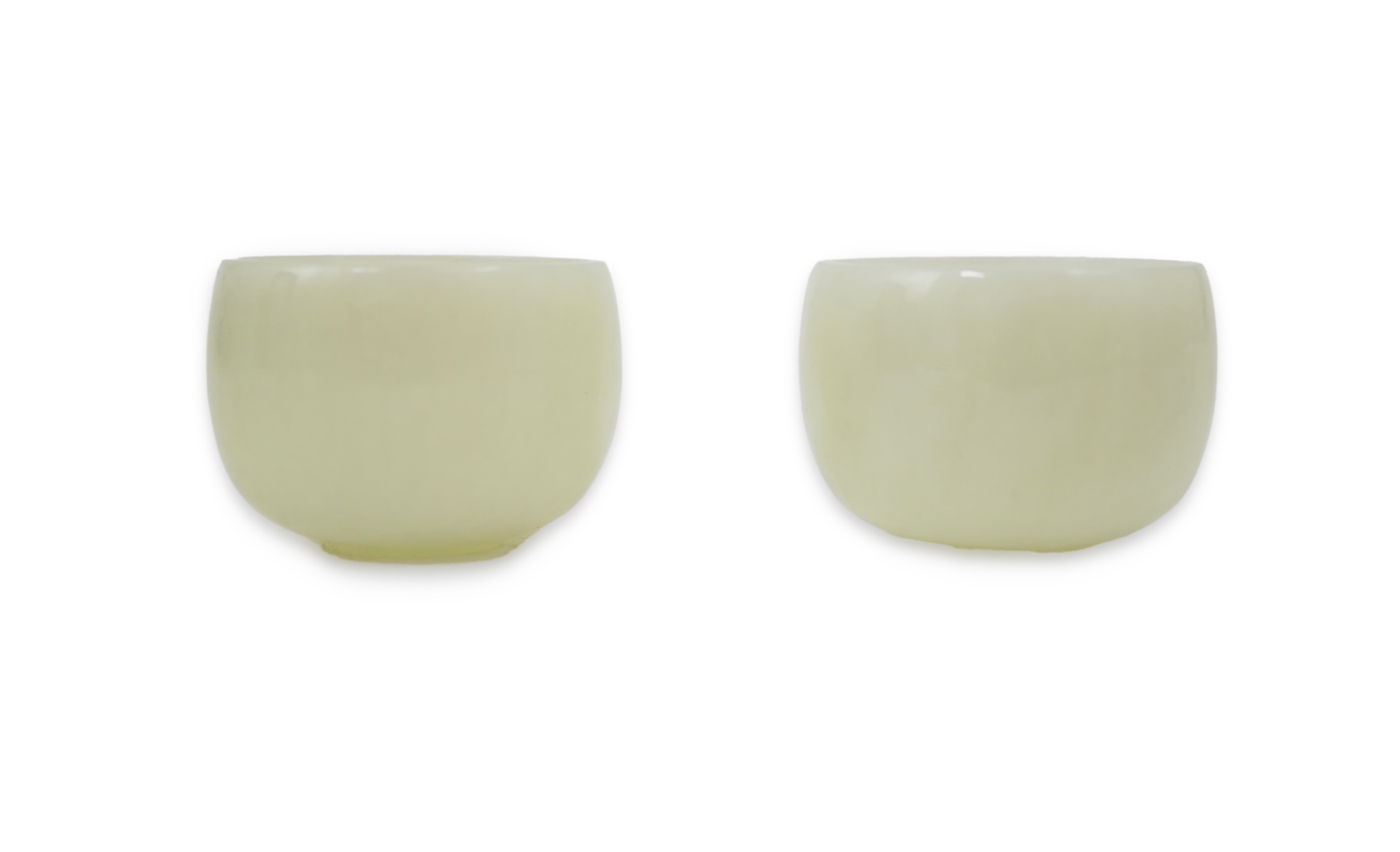 A pair of Chinese white jade cups, Qing dynasty or later